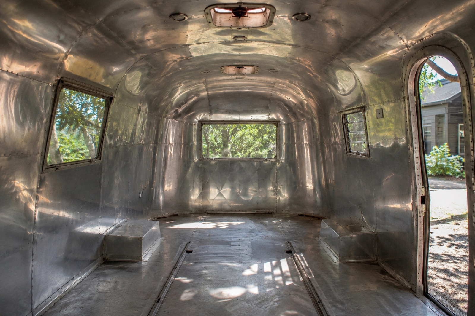 Bare polished aluminum Airstream shell before conversion